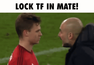 Man In Red Shirt Talking To Another Man On Soccer Field GIF