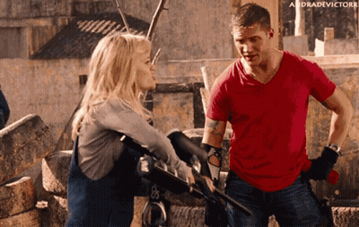 Man In Red Shirt Talking To Woman GIF