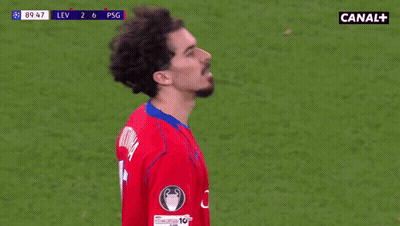 Man In Red Shirt Thumbs Up At Soccer Game Sponsored By Canal+ GIF