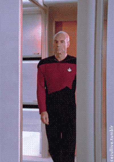 Man In Red Shirt Walking Through Doorway GIF