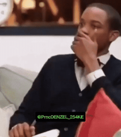 Man In Red Shirt Wearing Headphones Making Face GIF