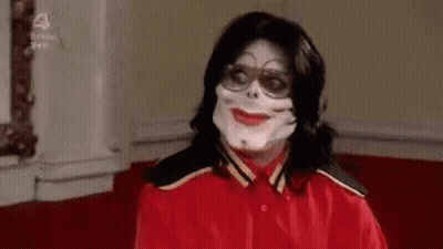 Man In Red Shirt Wearing Mask And Glasses GIF