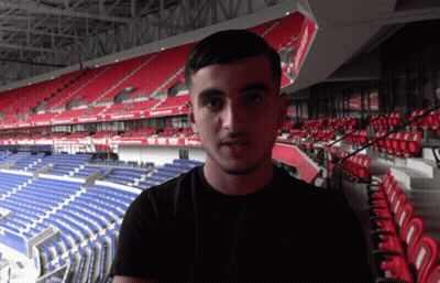 Man In Red Shirt With Arabic Writing GIF