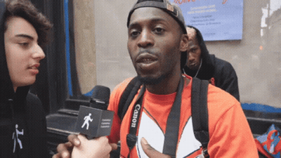Man In Red Shirt With Camera Strap GIF