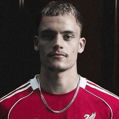 Man In Red Shirt With Cat Behind Him GIF