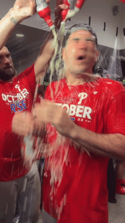 Man In Red Shirt With Letter P Showered With Beer GIF