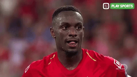 Man In Red Shirt With Play Sports Logo GIF