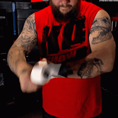 Man In Red Shirt With Show Wrapping Hands GIF
