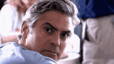 Man In Red Shirt With Smiley Smiling At Our Sign GIF