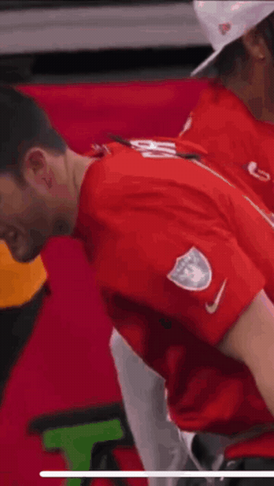 Man In Red Shirt With White Emblem GIF