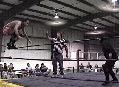 Man In Red Shorts Jumping As Referee Looks On GIF