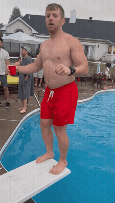Man In Red Shorts On Diving Board GIF