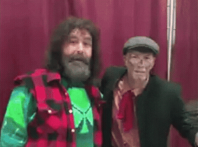 Man In Red Shorts With Orion In Wrestling Ring GIF
