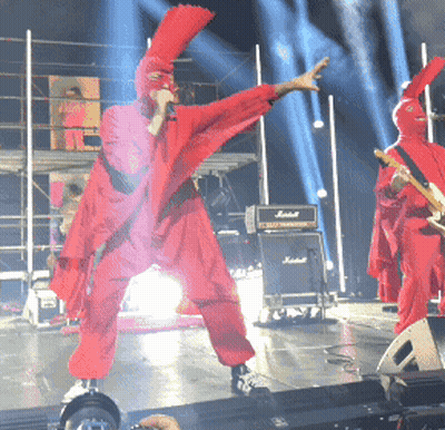 Man In Red Singing Into Microphone GIF