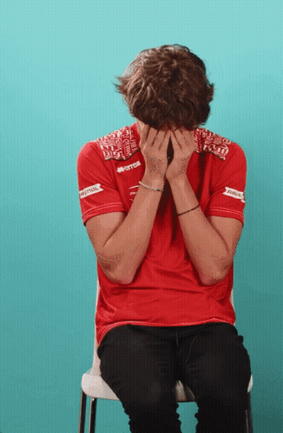 Man In Red Skull And Crossbones Shirt In Bleachers GIF