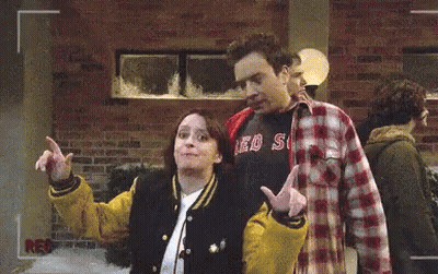 Man In Red Sox Shirt Next To Woman In Varsity Jacket GIF