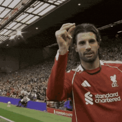 Man In Red Standard Chartered Jersey GIF