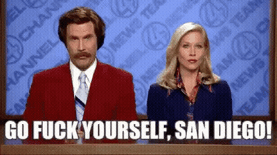 Man In Red Suit And Tie Beside Blue Dress Woman GIF