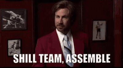 Man In Red Suit And Tie Saying Shill Team Assemble GIF