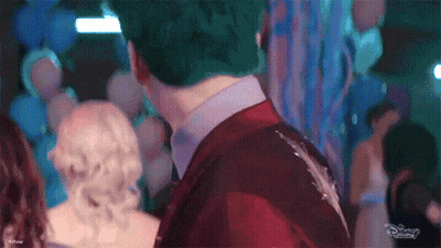 Man In Red Suit And Woman In White Dress At Party GIF