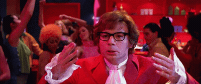 Man In Red Suit Dancing In Front Of Crowd GIF