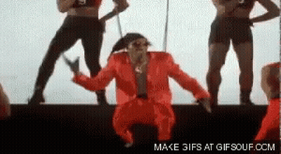 Man In Red Suit Dancing On Stage GIF