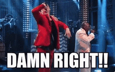 Man In Red Suit Dancing With Man In White Suit GIF