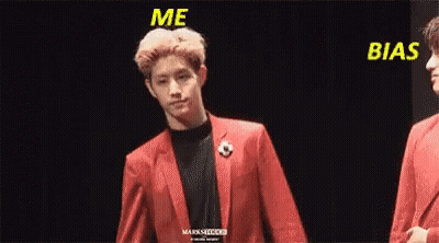 Man In Red Suit Holding Another Man's Hand GIF