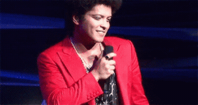 Man In Red Suit Holding Microphone GIF
