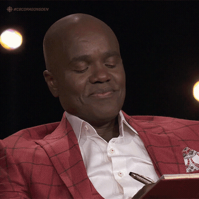 Man In Red Suit Holding Pen And Book GIF