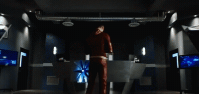 Man In Red Suit In Dark Room GIF