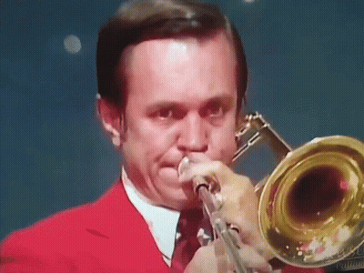 Man In Red Suit Playing Trombone GIF