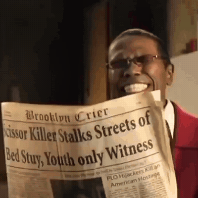 Man In Red Suit Reading Newspaper GIF
