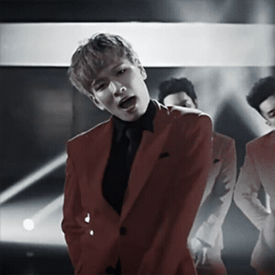 Man In Red Suit Singing Into Microphone GIF