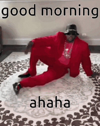 Man In Red Suit Sitting Cross-Legged GIF
