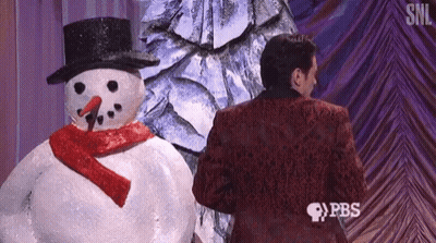 Man In Red Suit Standing Next To Snowman GIF