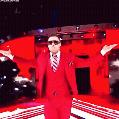Man In Red Suit With Arms Outstretched GIF