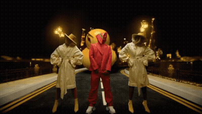 Man In Red Suit With Two Women In Bathrobes GIF