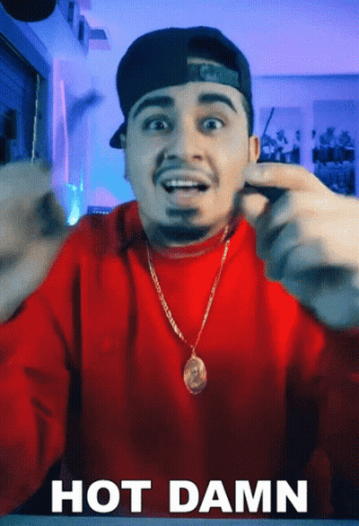 Man In Red Sweater And Hat Making Funny Face Saying Hot Damn GIF
