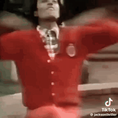 Man In Red Sweater And Tie Dancing GIF
