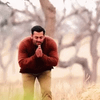 Man In Red Sweater Kneeling In Prayer GIF