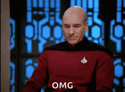 Man In Red Sweater Making Funny Face By Window GIF