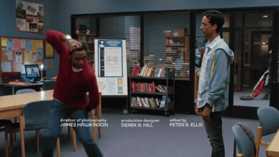 Man In Red Sweater Next To Man In Blue Shirt GIF