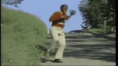 Man In Red Sweater Running Down Road GIF