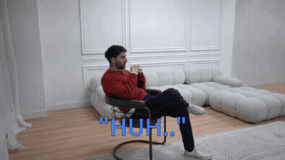 Man In Red Sweater Saying Huh GIF