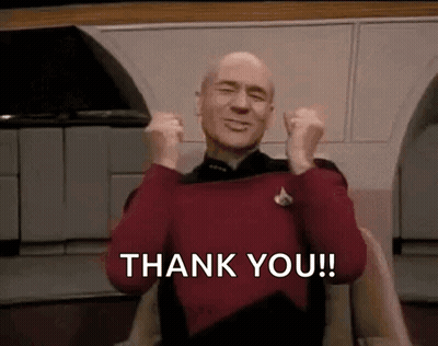 Man In Red Sweater Sitting With Arms Up Saying Thank You GIF