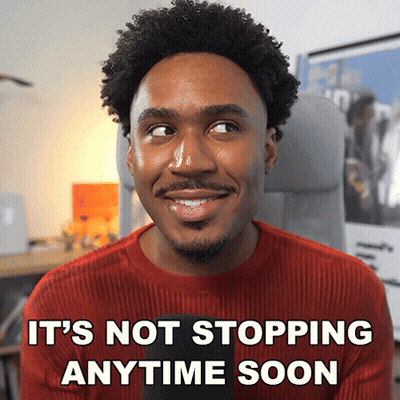 Man In Red Sweater Smiling It's Not Stopping Anytime Soon GIF