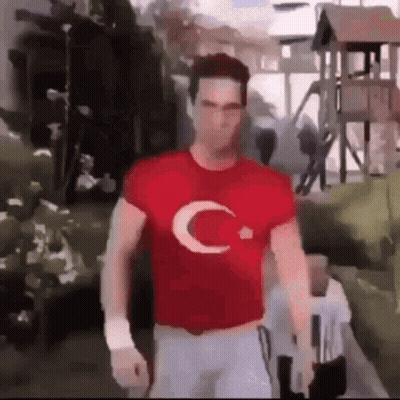 Man In Red T-Shirt With C Walking GIF