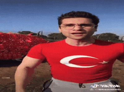 Man in Red T-Shirt With White Crescent Moon