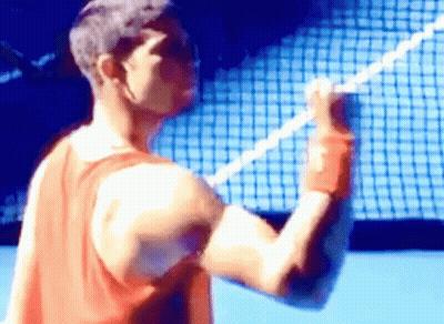 Man In Red Tank Top Holding Tennis Racquet GIF